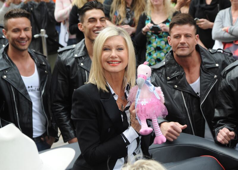 A handout photo made available by the Las Vegas News Bureau shows Olivia Newton-John arriving at the Flamingo in Las Vegas, Nevada, USA, 02 April 2014 (issued 09 August 2022).  Olivia Newton-John died from cancer at the age of 73 at her home in Southern California on 08 August 2022.   EPA / BRIAN JONES  /  LAS VEGAS NEWS BUREAU  /  HANDOUT Mandatory credit: EPA via Las Vegas News Bureau /  Brian Jones HANDOUT EDITORIAL USE ONLY / NO SALES