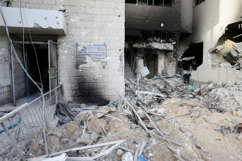 Palestinians inspect damages at Al Shifa Hospital after Israeli forces withdrew from the Hospital and the area around it following a two-week operation, amid the ongoing conflict between Israel and Hamas, in Gaza City on April1. Reuters