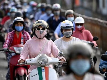 Morning commuters wear face masks in the Vietnamese capital Hanoi. AFP